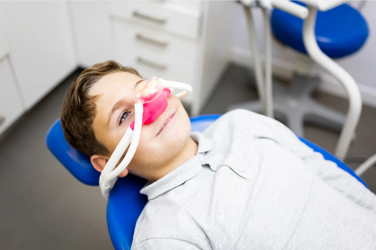 child receiving nitrous oxide sedation at pediatric dental office in Bedminster